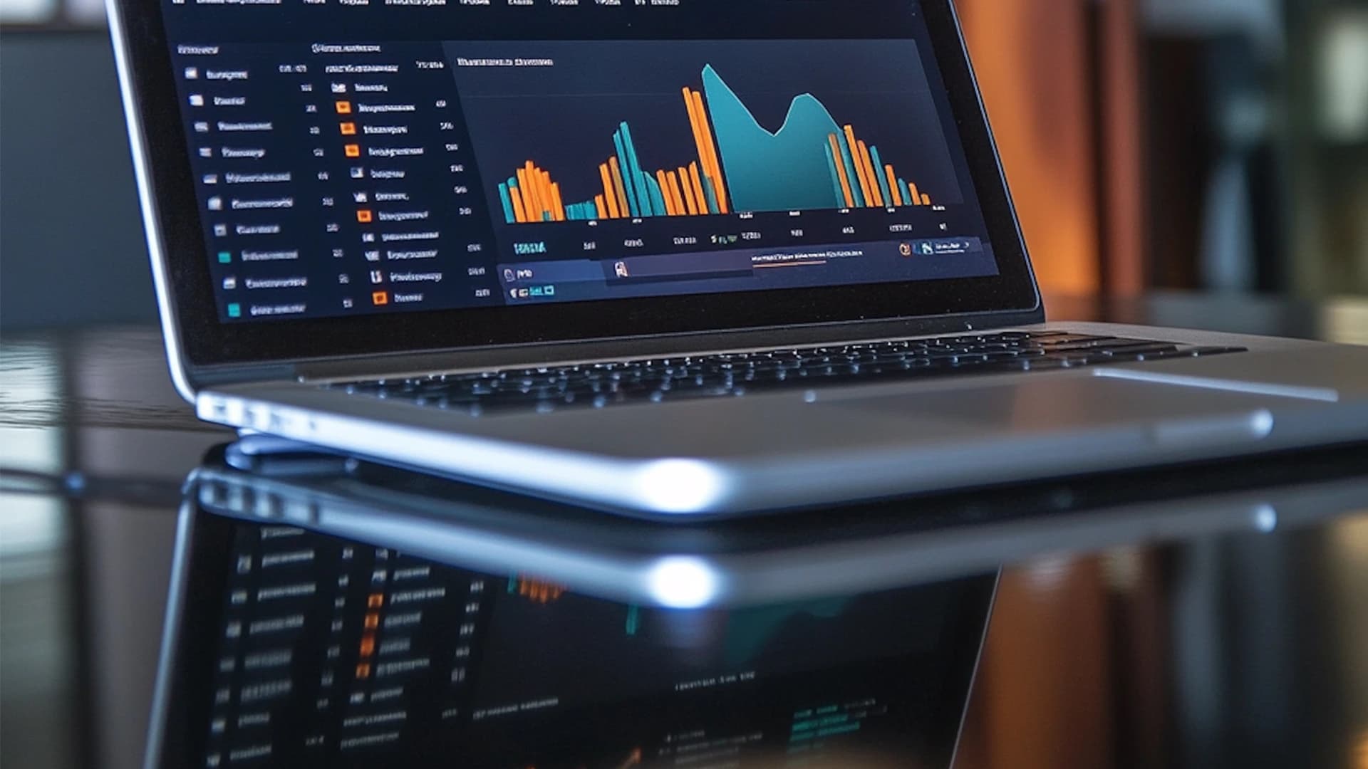 Laptop on desk showing a graph